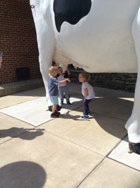 Photo of the kids with a giant cow